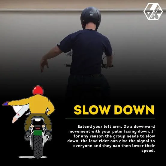 Mastering Motorcycle Hand Signals for Effective Communication on the Road: Slow Down Mastering Motorcycle Hand Signals for Effective Communication on the Road: Slow Down