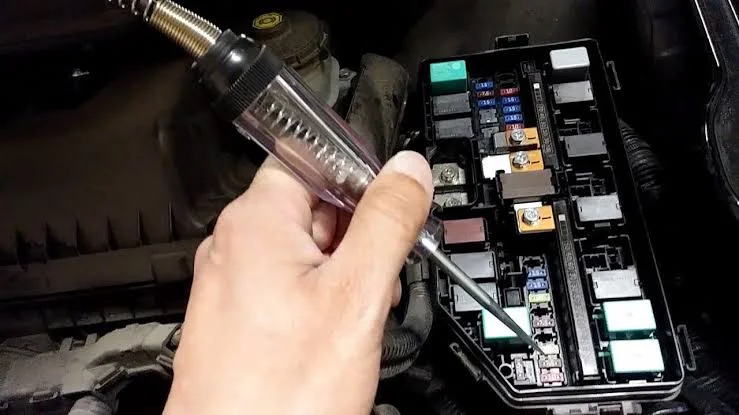 Testing car fuses with a test light