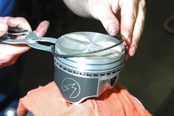 What are the functions of piston rings?