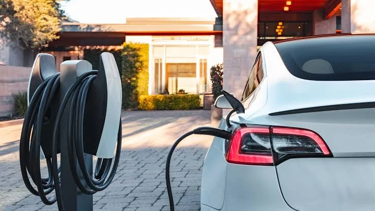 Can I charge my EV at home using a regular power outlet?