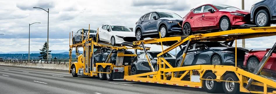 Car Carriers: Efficiently Transporting Multiple Vehicles