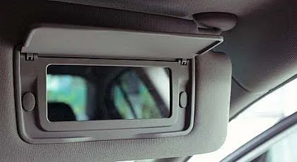 The Hidden Mirror In Your Sun Visor Actually Has A Surprising Backstory