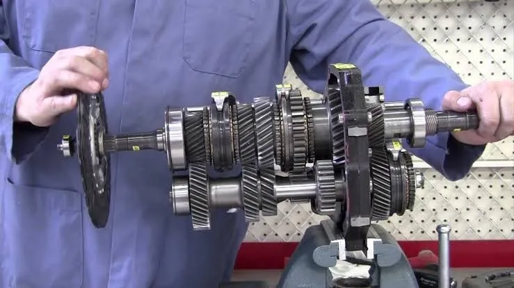 What should I do if my manual transmission is slipping or pops out of gear?